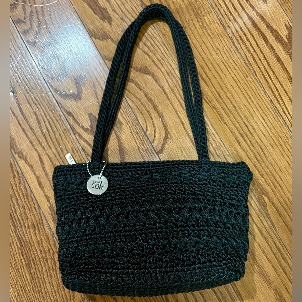 The Sak brand small black crochet handbag